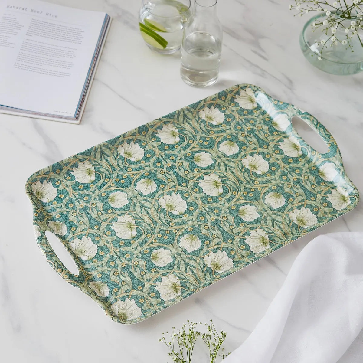 angled view of Pimpernel Floral Melamine Tray set on a marble surface