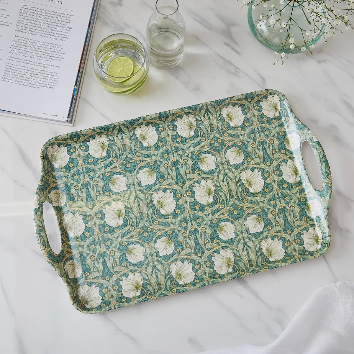 top view of Pimpernel Floral Melamine Tray set on a marble surface with beverage around it