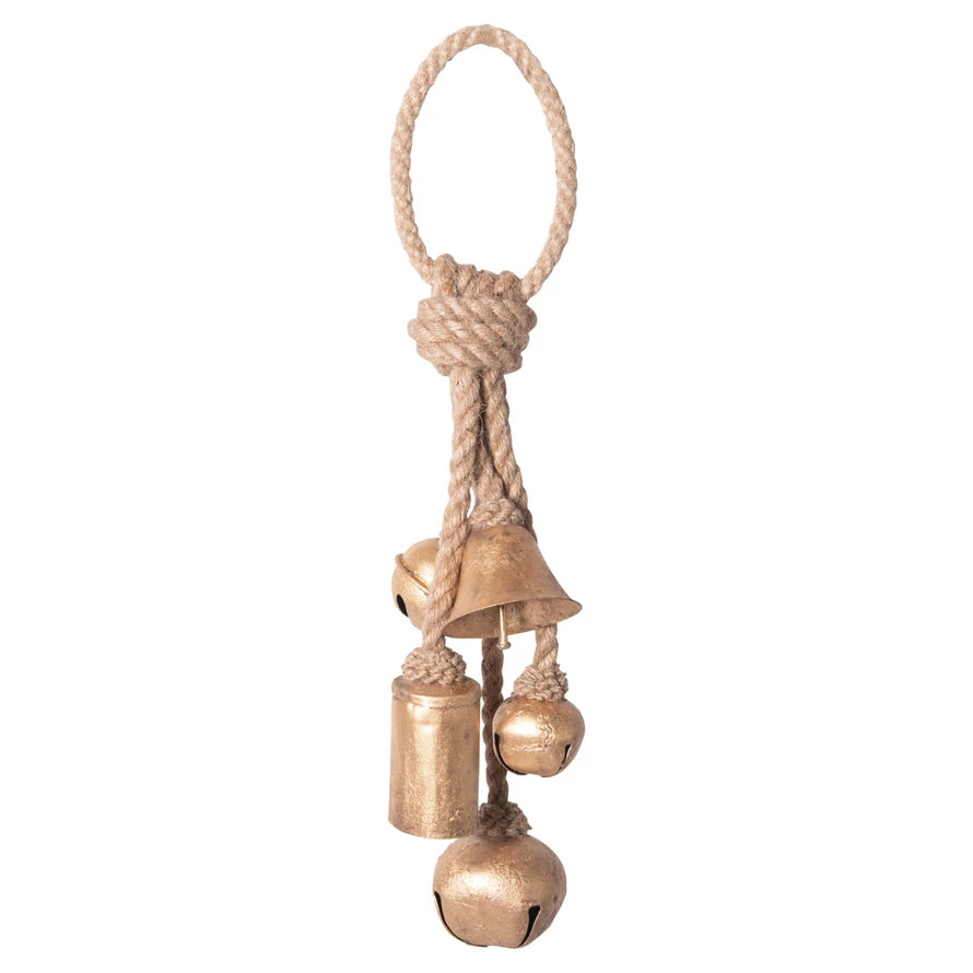 Decorative metal bells on a rope shown  on a white background