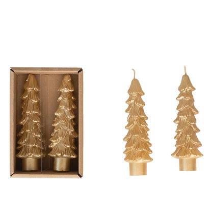 gold tree shaped taper candles in the box and 2 others next to the box on a white background.