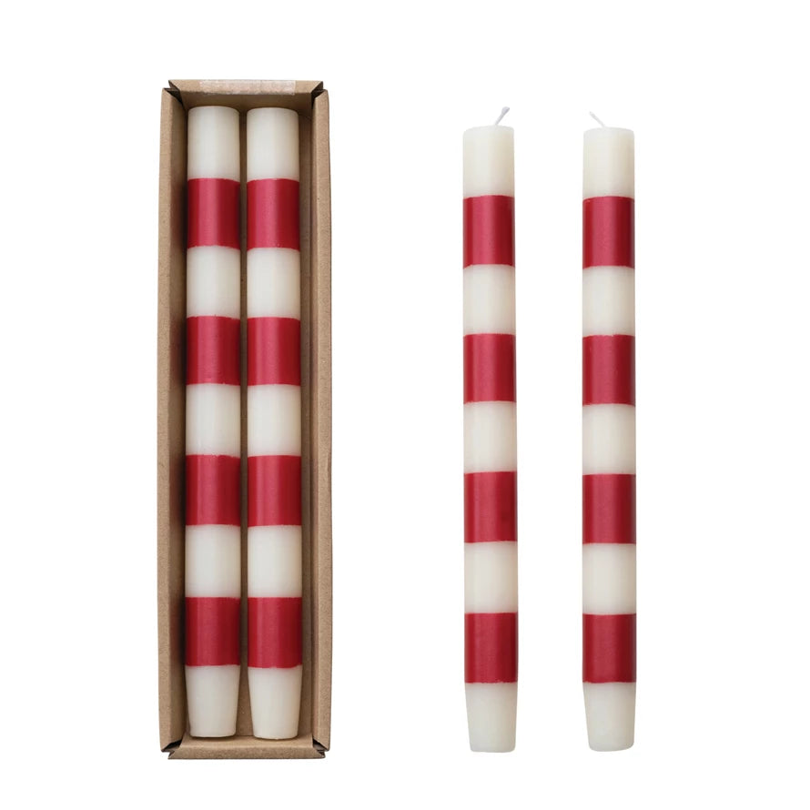 red and white striped candles on a white backgorund.