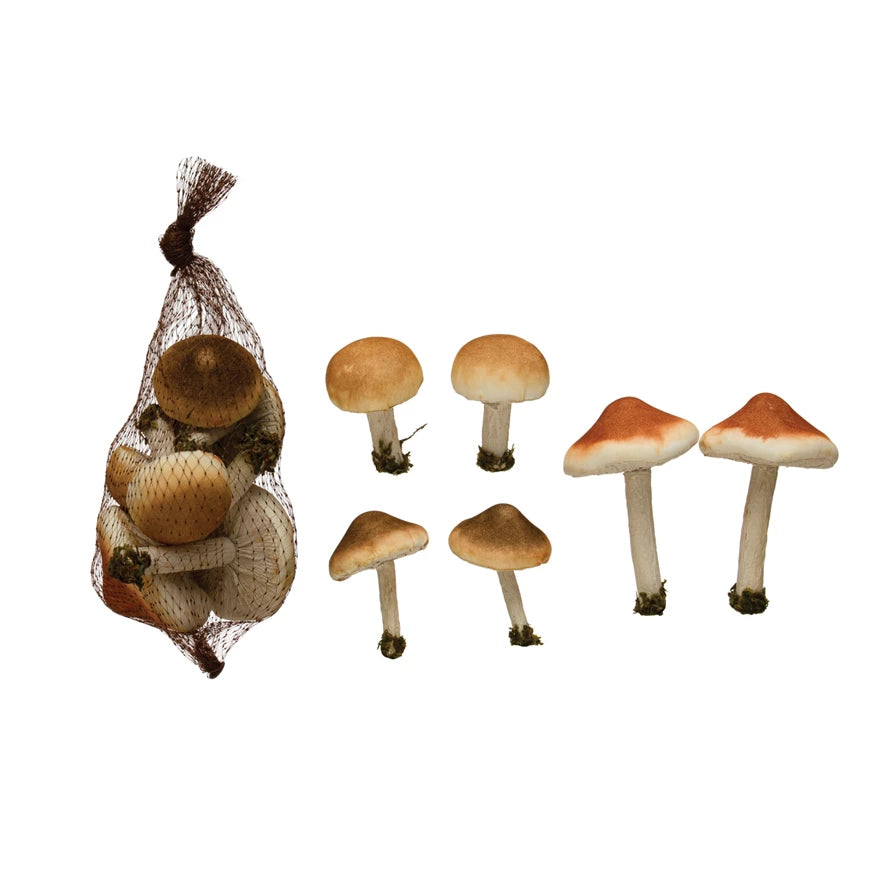 bag of foam mushrooms with moss displayed next to 6 opened foam mushrooms displayed on a white background