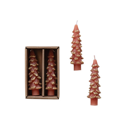 coral colored tree shaped taper candles in box with 2 others laying next to the box on a white background.