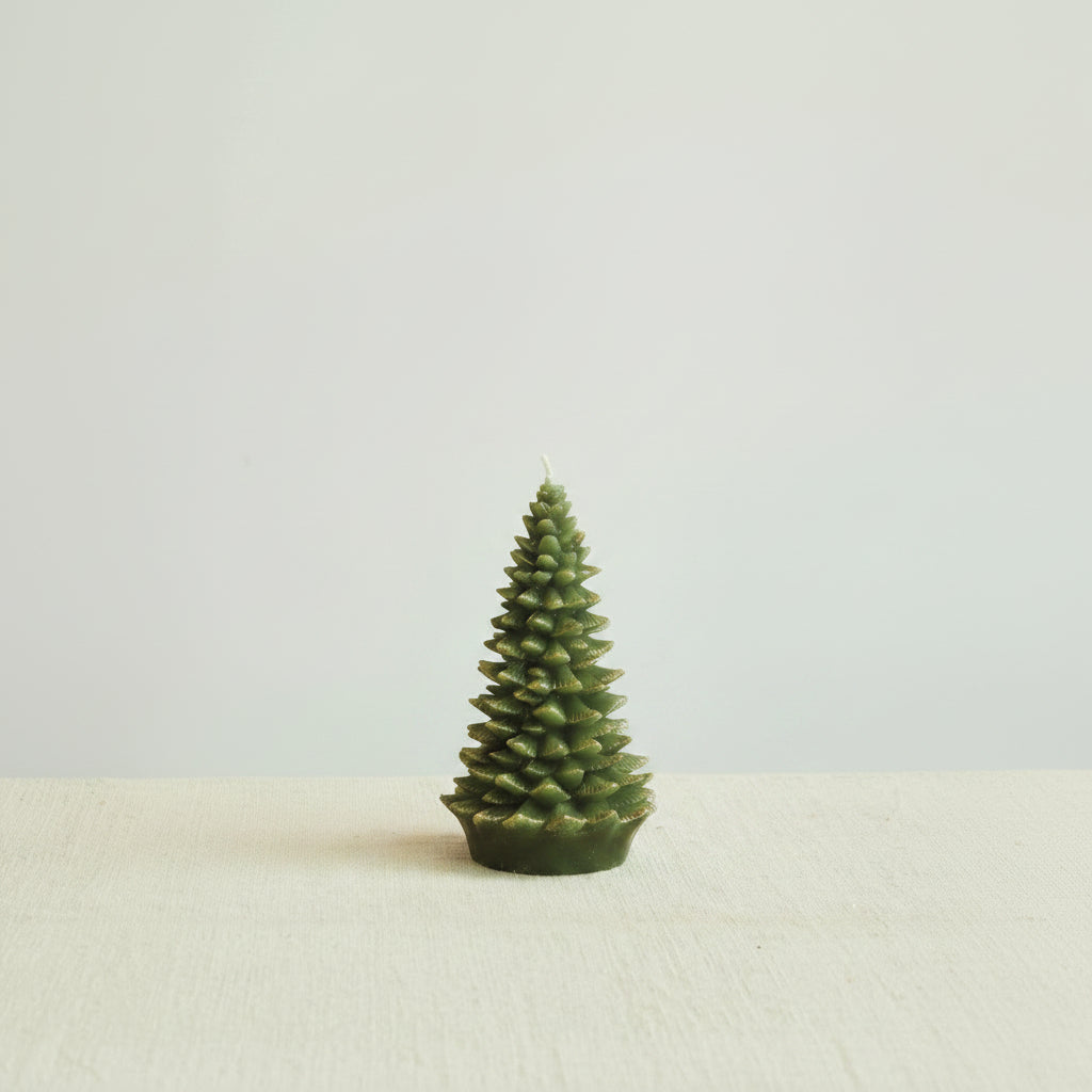 large evergreen tree candles next on a decorated surface