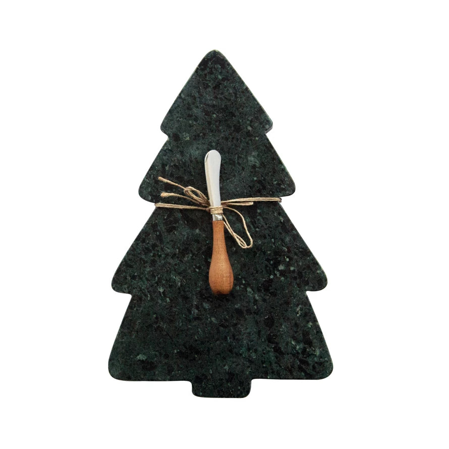 dark green marble board shaped like a tree with a wooden handled spreader tied to it.