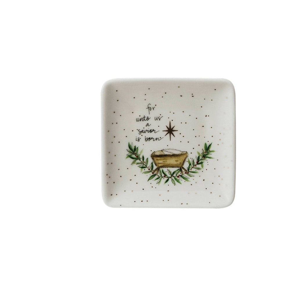 small square dish with image of manger with greenery under in, a star above it, and text "for unto us a savior is born" printed on it