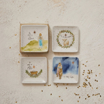 assorted Petite Square Christmas Dishes arranged on a plaster surface with gold confetti