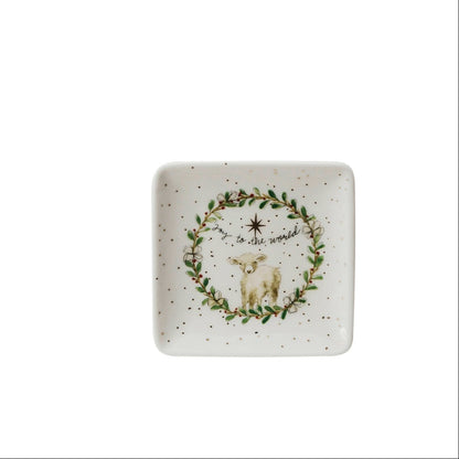 small square dish with image of a greenery wreath around a lamb and text "jo to the world" printed on it
