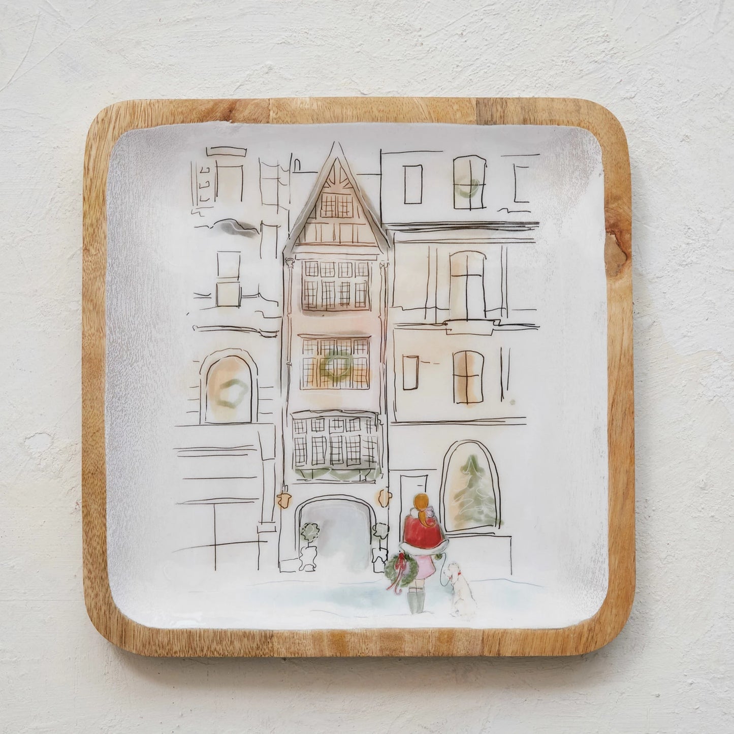 holiday girl tray shown on a plaster background.