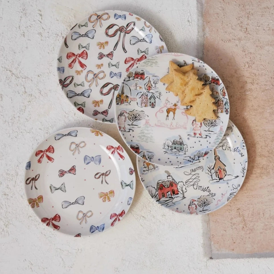 4 styles of holiday pattern plates arranged on a plaster surface.