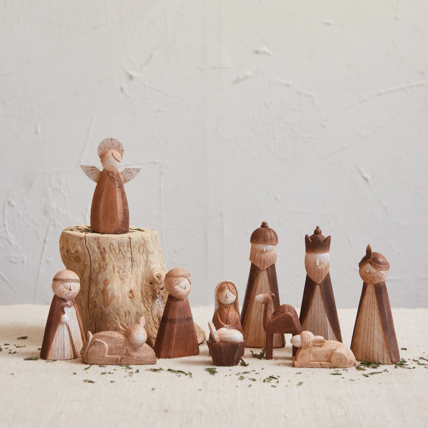 11 pieces of the petite nativity arranged on a table.