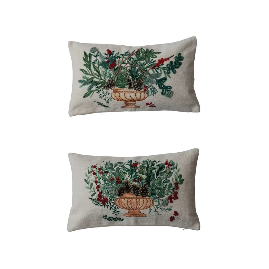 2 winter botanical pillows on a white background.