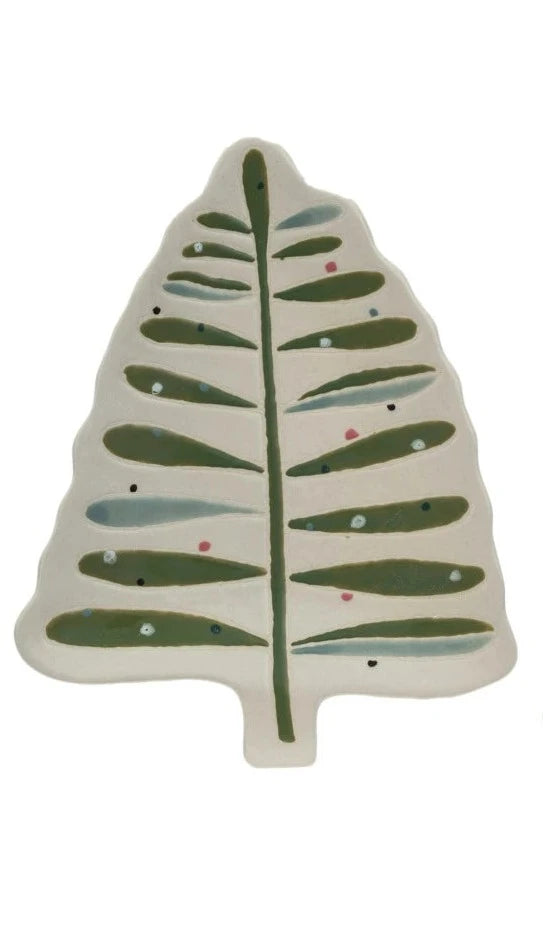 cream colored tree shaped plate with green and blue leaves.