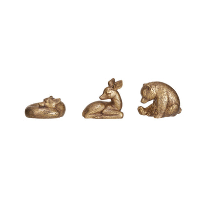 3 gold animals in a row on a white background