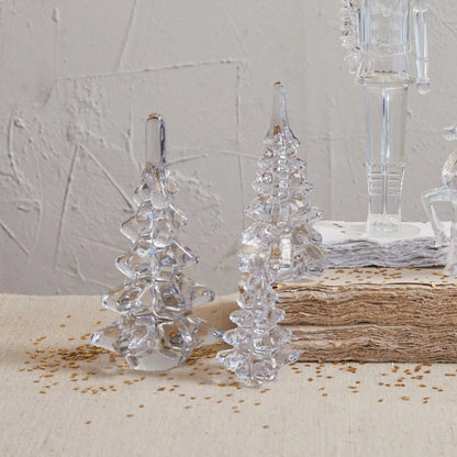 Glass Christmas Trees arranged on a table with books and gold confetti