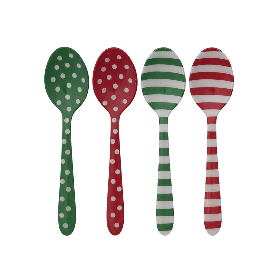 assorted Enameled Stripes or Dots Spoons whit red, white, and green patterns in a row on a white background