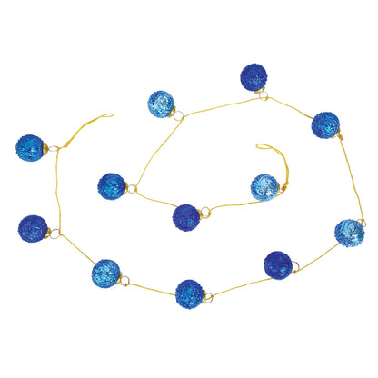 blue ornament garland draped on a white background