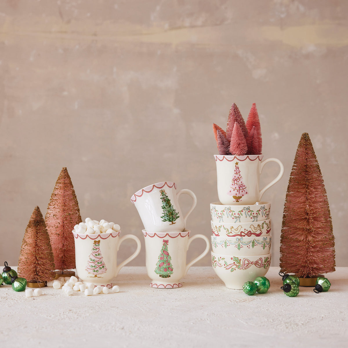 4 christmas tree mugs and bowls decorated with bottle brush trees and marshmallows 