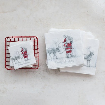 stacks of Santa & Reindeer Paper Napkins arranged on a marble surface