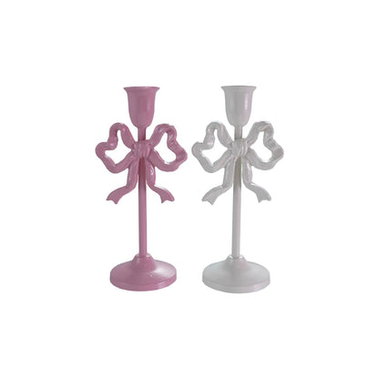 pink and white tall Cast Iron Bow Taper Holders