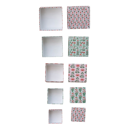 top down view of 5 paper gift boxes open next to their lids