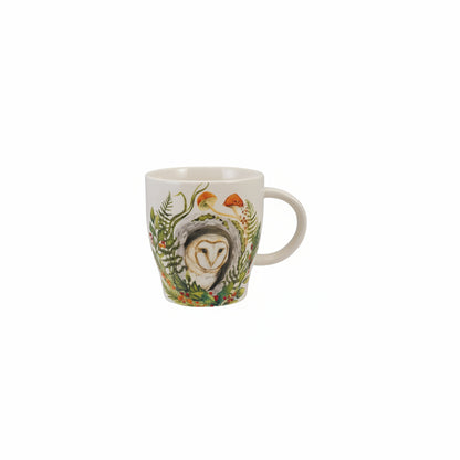 mug with image of an owl peeking out of lush greenery on it