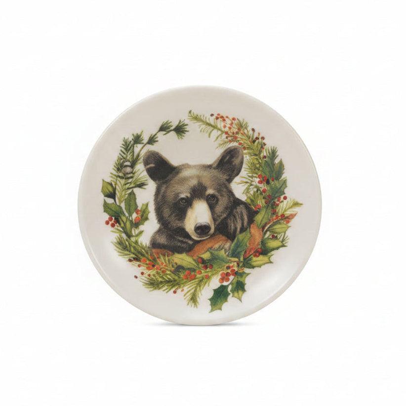 small trinket plate with image of a black bear surrounded by lush greenery on it