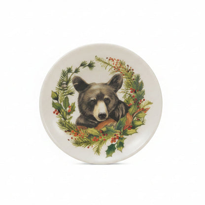 small trinket plate with image of a black bear surrounded by lush greenery on it