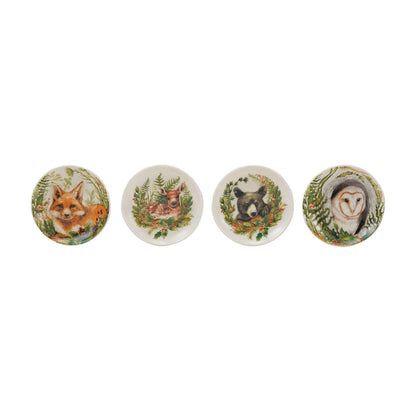 four animal plates in a row on a white background