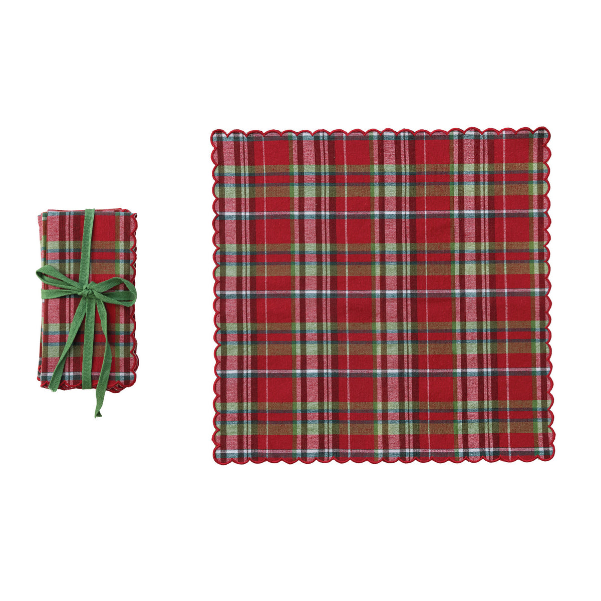 plaid tartan napkin set next to an unfolded napkin on a white background