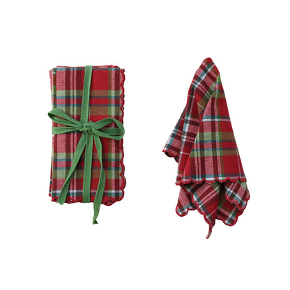 plaid tartan napkin set next to a slightly folded napkin