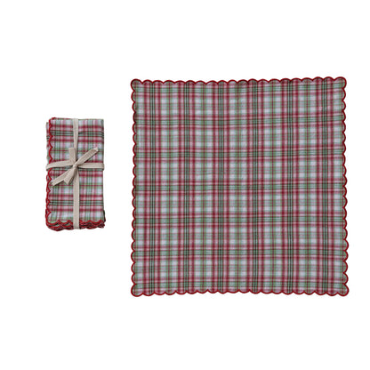 set of napkins next to an unfolded napkin on a white background