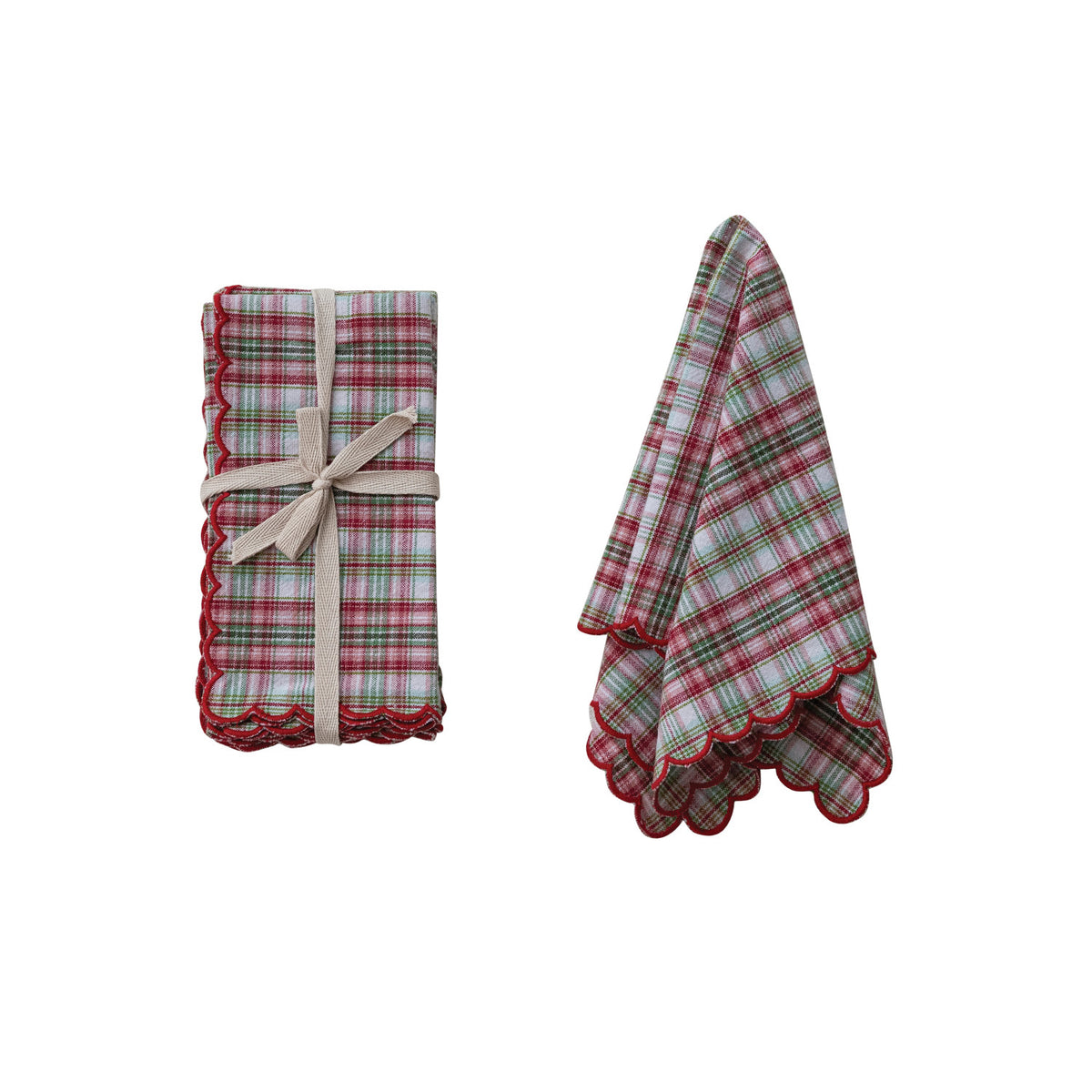 set of napkins next to a slightly folded napkin on a white background