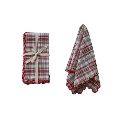 set of napkins next to a slightly folded napkin on a white background