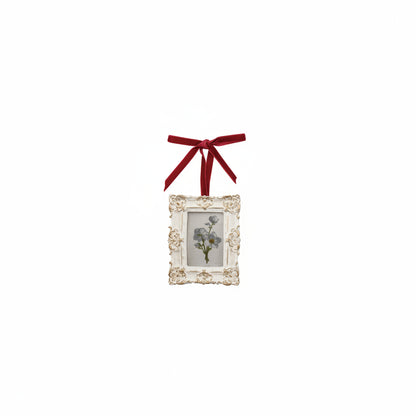 rectangle frame with blueish white flower in frame
