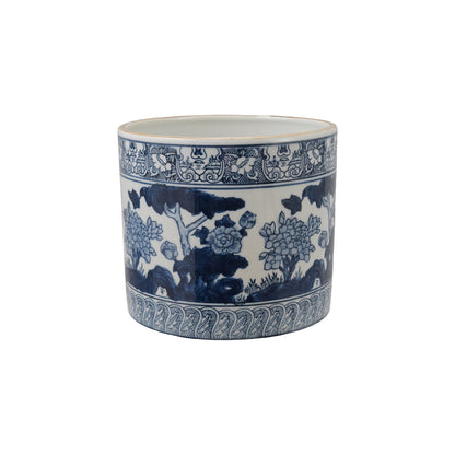 blue and white botanical planter shown on a white background