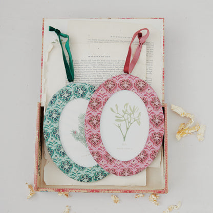 2 frame ornaments arranged on book pages