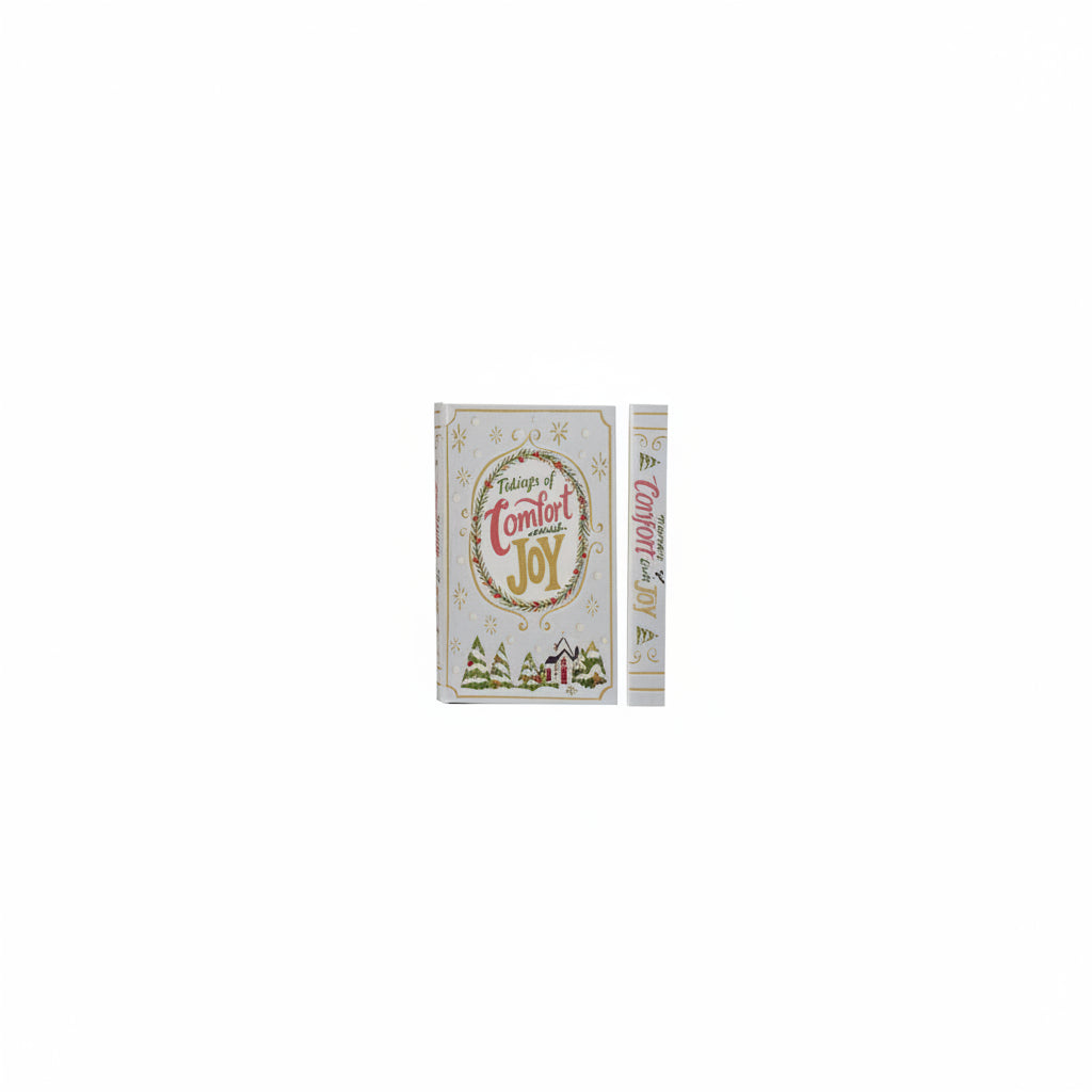 cover and spine views of pale blue book box titled 'tidings of comfort and joy' with village scene across the bottom
