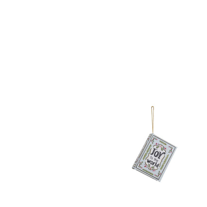 book ornament with pale blue cover titled 'joy to the world' with evergreen designs
