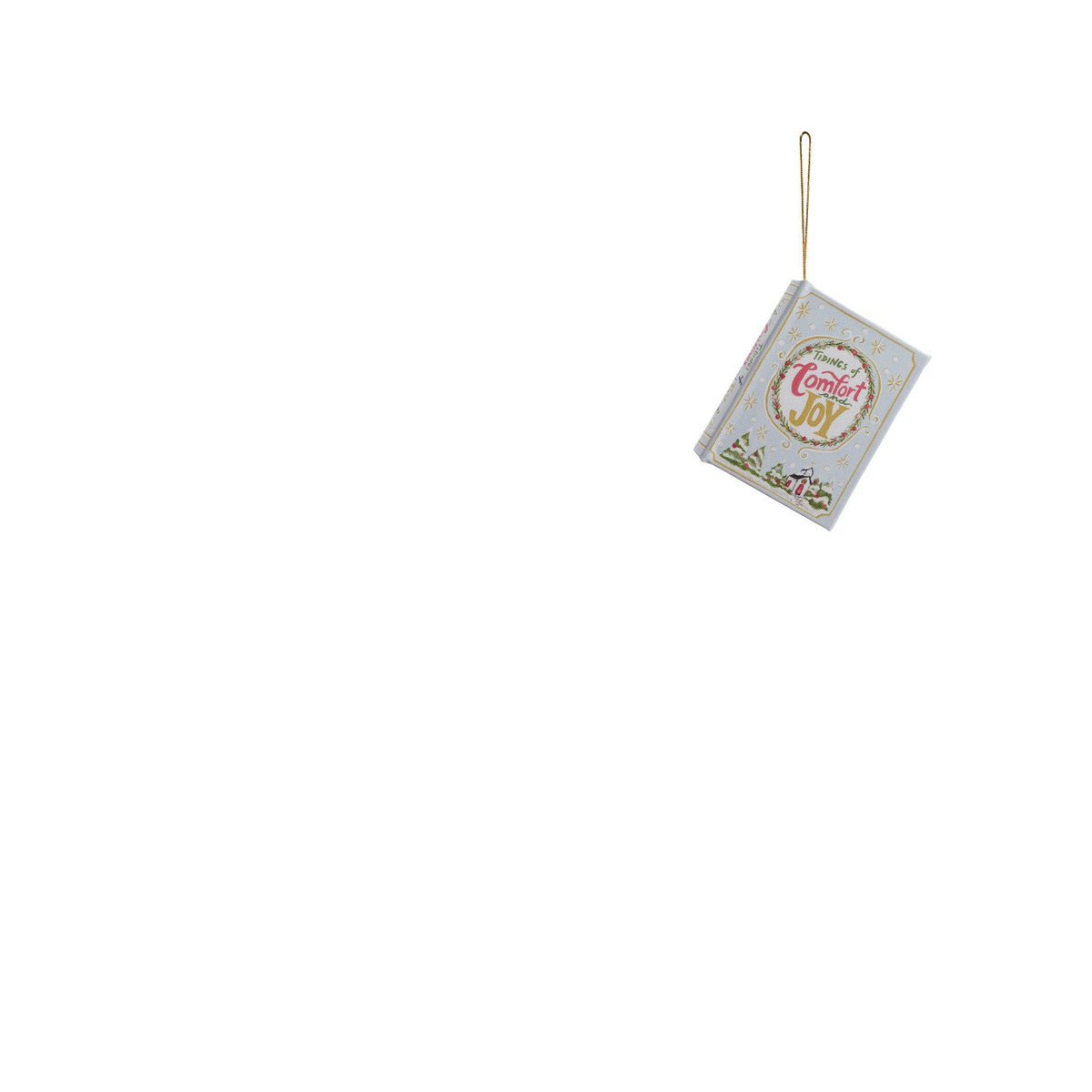 book ornament with pale book cover tilted tidings of comfort and joy with village design across the bottom