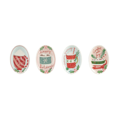 4 trinket dishes with christmas designs in a row against a white background