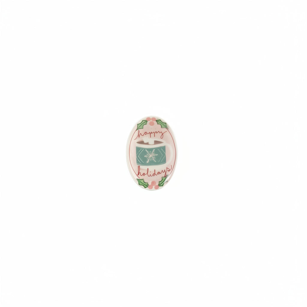 small oval dish printed with white and blue mug with snowflake design and "happy holidays" on it