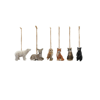 six animals sitting in a row against a white background