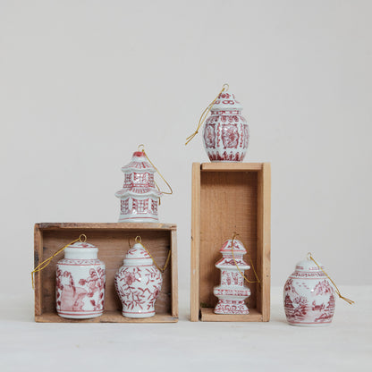 6 different red and white ginger jar ornaments on a decorated background