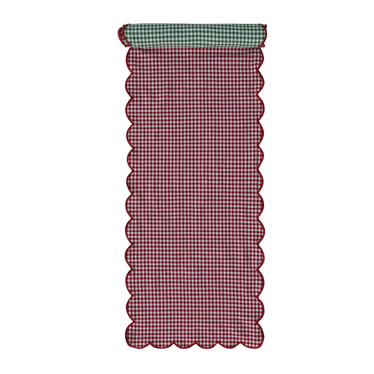 red side of the gingham table runner rolled slightly to show the green side