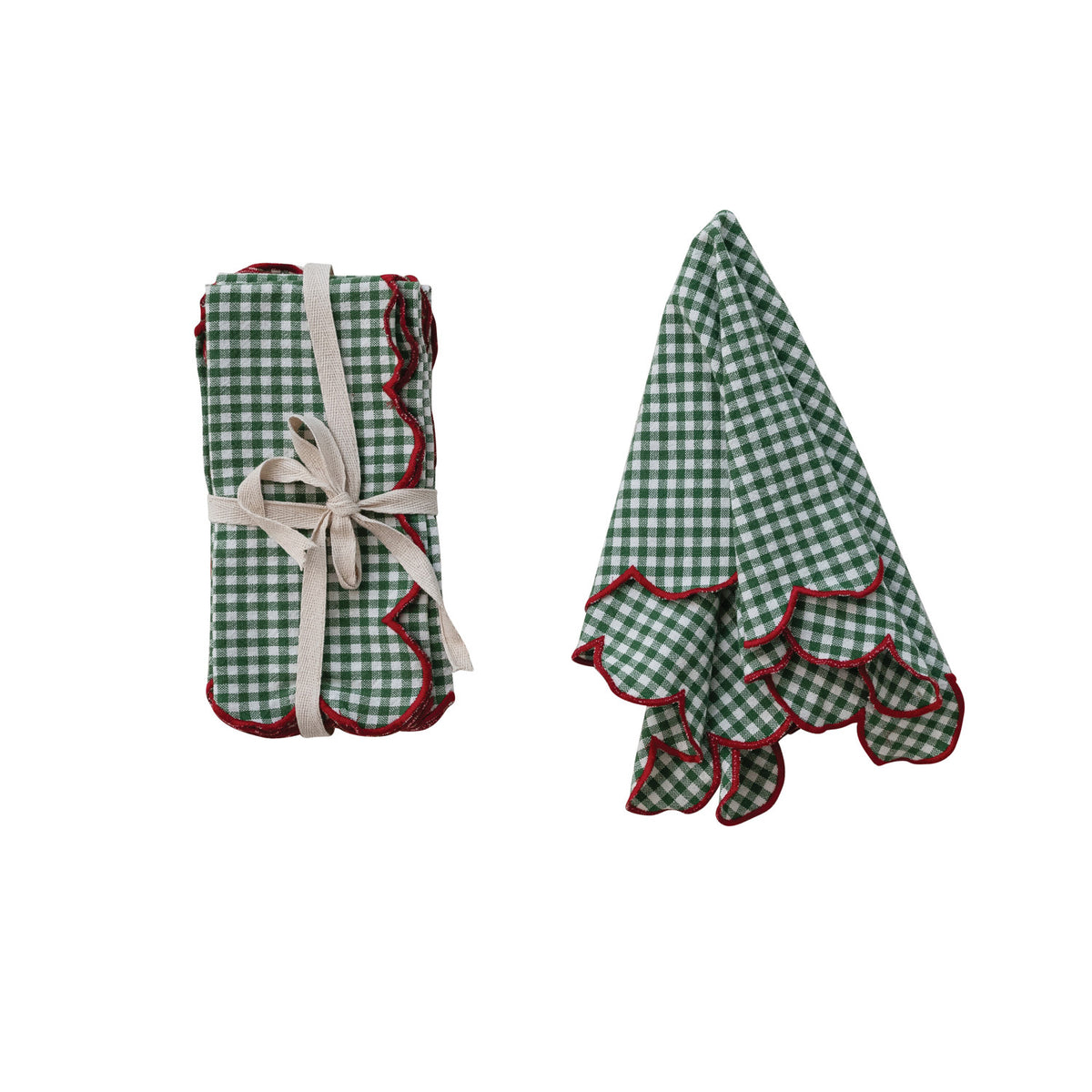 green gingham napkin set next to an lightly gathered napkin