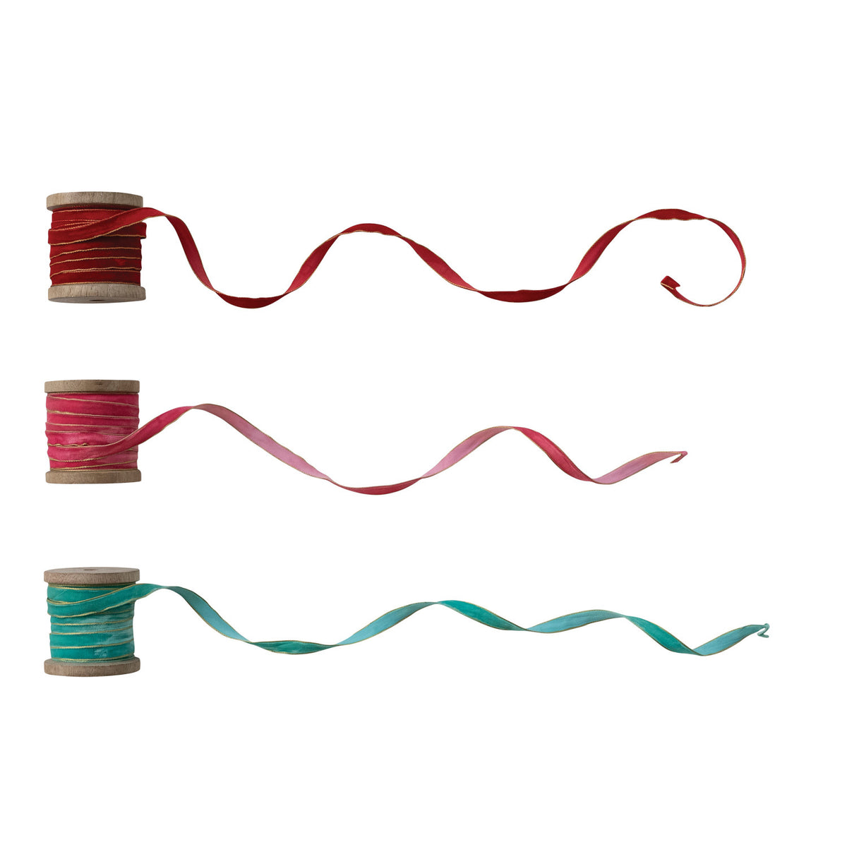 3 spools of ribbon unraveling on a white background