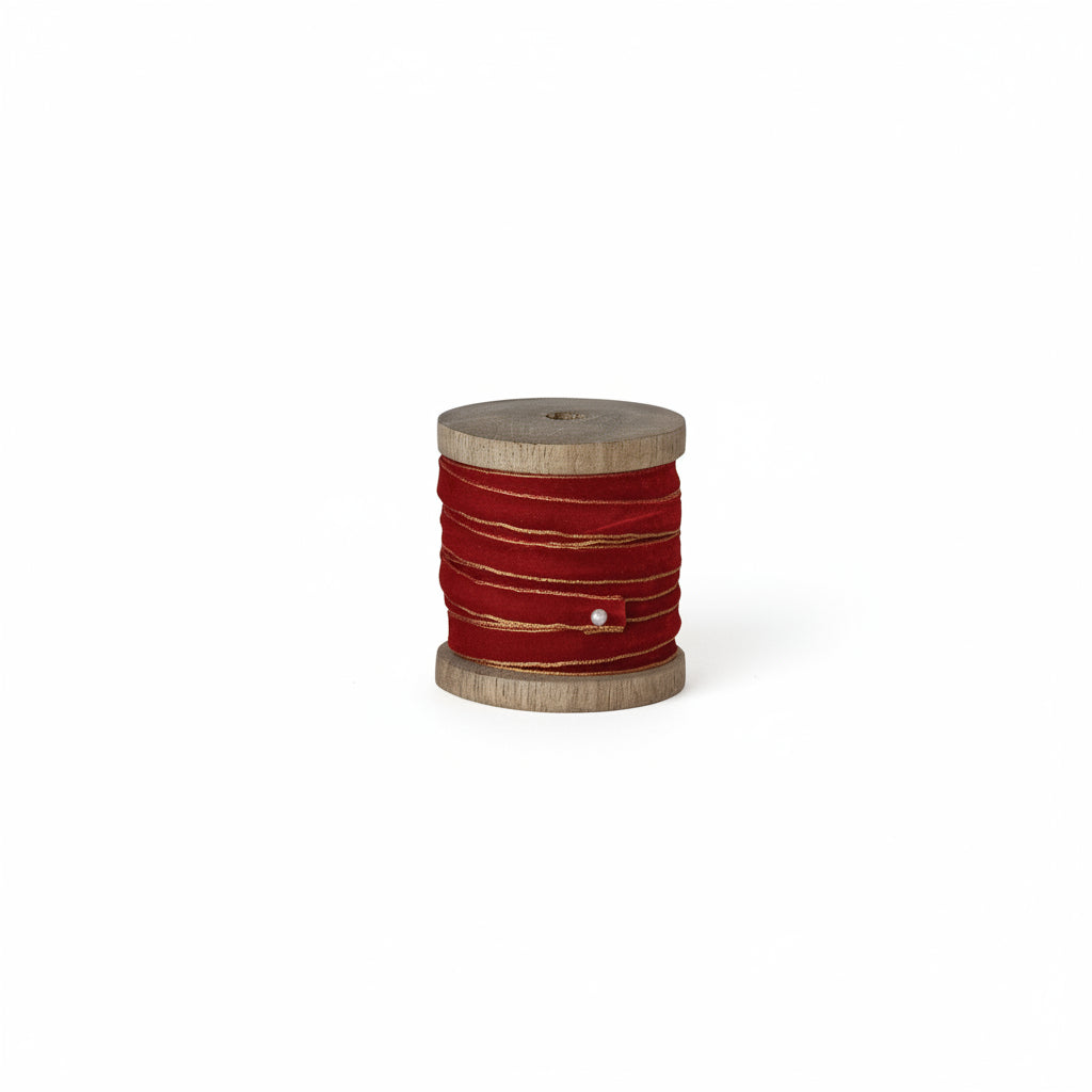 red ribbon on a wood spool
