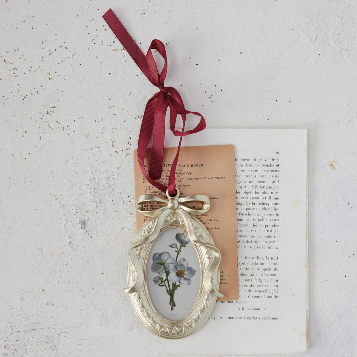 Photo Frame Ornament with Bow Ribbon Hanger on a decorated setting