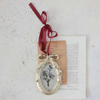 Photo Frame Ornament with Bow Ribbon Hanger on a decorated setting